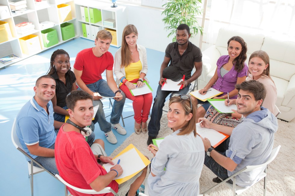Group of students sitting in a circle.